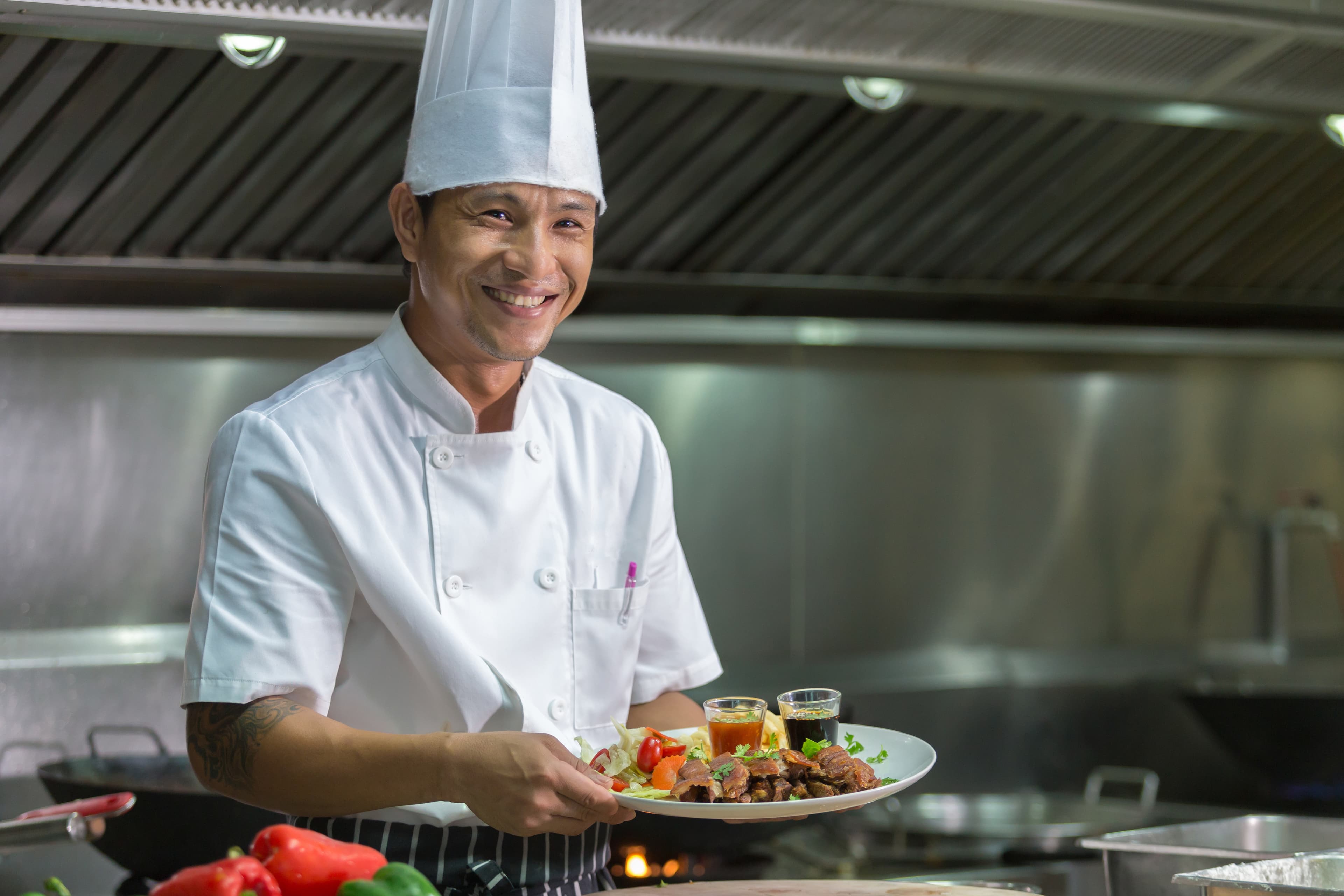 Chef holding a plate of food